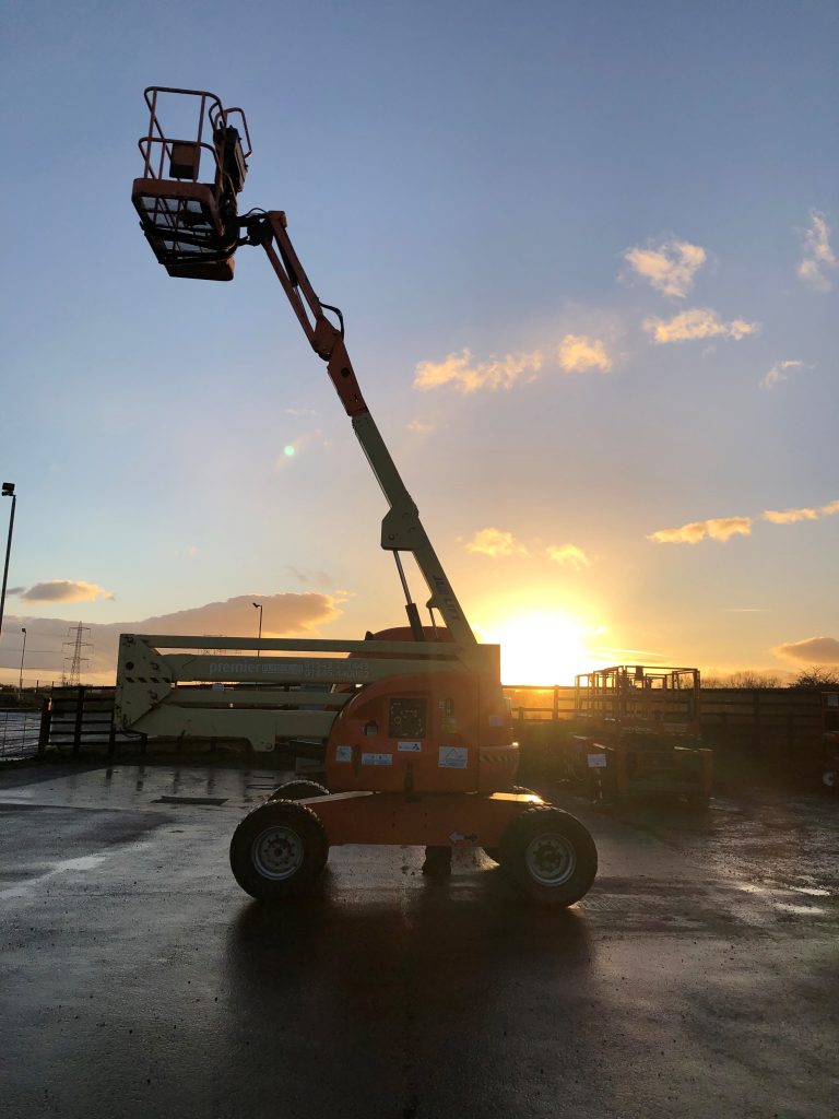 Telescopic boom in front of a sunset